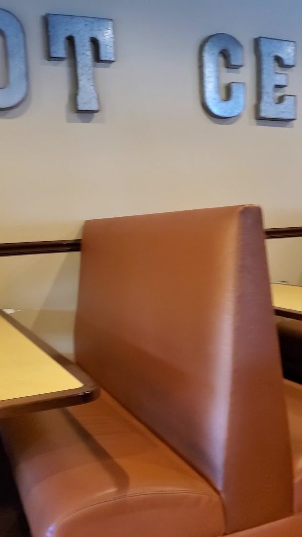 Casual interior with soft lighting and table service.